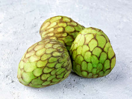 Cherimoya fruitson a grey backgroundの写真素材