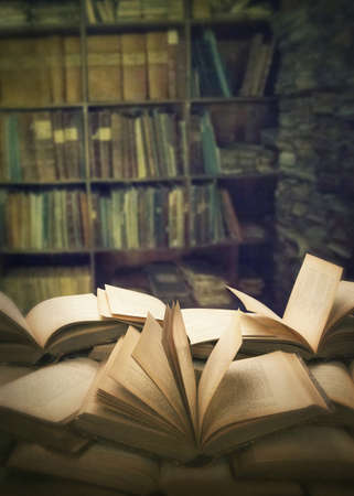 Pile of open books on the table