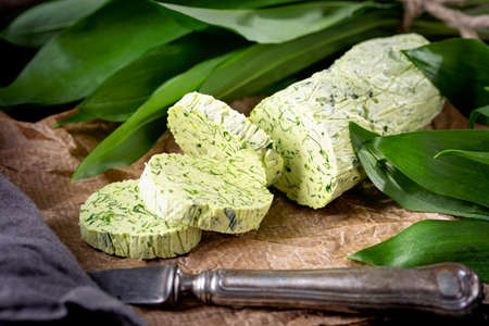 Homemade wild garlic butter and fresh leavesの写真素材