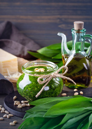Homemade wild garlic pesto on dark wooden backgroundの写真素材