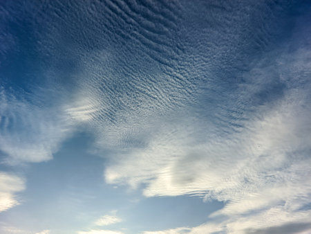 Summer blue sky clouds gradient on bright white background. Cloudy sunny beauty in the sun, calm, sunny winter air background.の写真素材