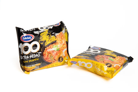 Jakarta, Indonesia - September 2, 2023: Two packs of Gaga instant noodle soup with jalapeno flavor on a white isolated background. Selective focusのeditorial素材