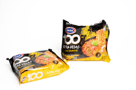Jakarta, Indonesia - September 2, 2023: Two packs of Gaga instant noodle soup with jalapeno flavor on a white isolated background. Selective focusのeditorial素材