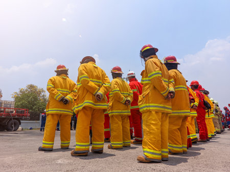 Jakarta, Indonesia - October 12, 2023: Indonesian firefighters line up in front of their equipmentのeditorial素材