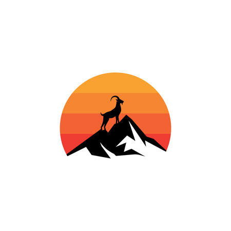 Silhouette of a goat on a mountain peak with a sunset background.のイラスト素材