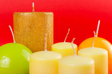 Decorative candles in different shapes sizes and colorsの写真素材