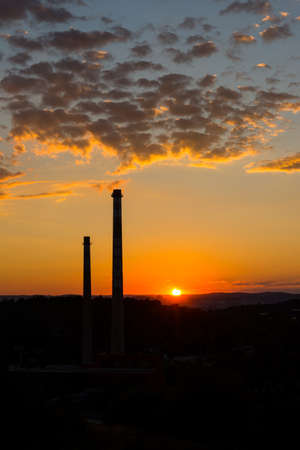 Sunset above the city chimney, chemical industryの写真素材
