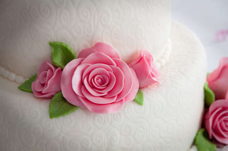 White wedding cake with the rosesの写真素材