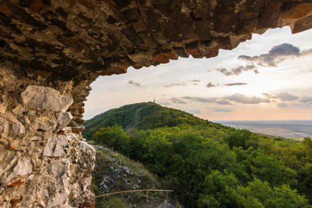 Castle in Palava, Czech republic, ruins of wall, landscape panorama of near village.の写真素材