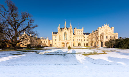 The Lednice castle panorama in snow, winter. Beautiful old historical architecture, blue sky. Czech republicのeditorial素材