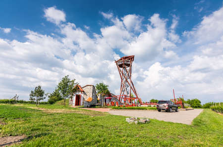South Moravia, Velke Pavlovice: Lookout tower near vineyard. Nice tourist place on agriculture land. Tower construction, summer weather and nice clouds.の写真素材