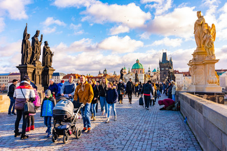 PRAGUE, CZECH REPUBLIC - 1.12.2018: Charles bridge, ancient bridge over the Vltava river in Prague, czech capital. Tourist are walking on bridge. Prague castle in background.のeditorial素材