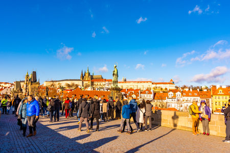 PRAGUE, CZECH REPUBLIC - 1.12.2018: Charles bridge, ancient bridge over the Vltava river in Prague, czech capital. Tourist are walking on bridge. Prague castle in background.のeditorial素材
