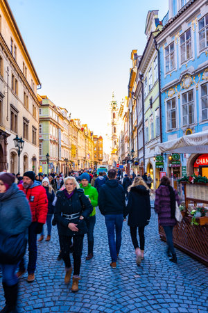 PRAGUE, CZECH REPUBLIC - 1.12.2018: Prague old city town center. City street with tourist, shops, cafee, restaurants. Ancient historical buildings in Czech capital. European travel in bohemiaのeditorial素材