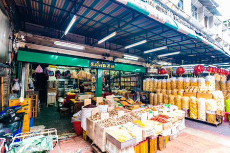 BANGKOK, THAILAND - 1.11.2019: Market in the China district in Bangkok city, Thailand. Food, fruit and other type of goods on the street. Peoples are walking and shopping. Fresh street foodのeditorial素材