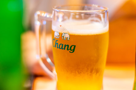 BANGKOK, THAILAND - 1.11.2019: Detail of glass with Chang beer. Chang is traditional Thailand beer and alcoholic beverage. Is served cold in bottle or glass. Original product of Thailand.のeditorial素材