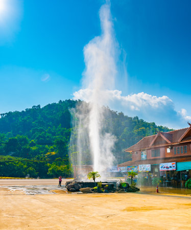 CHIANG RAI, THAILAND - 6.11.2019: Thaweesin hot spring. Hot waterand geothermal geyser squirts from the ground with big steam cloud. Near is the Wiang Pa Pao temple. Famous tourist destinationのeditorial素材