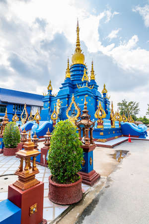 Beautiful blue pagoda at Wat Rong Suea Ten Temple, also known as the Blue Temple. Wat Rong Suea Ten or the Tiger Temple is located near Chiang Rai city, Thailand. Blue sky with dramatic dynamic cloudsの写真素材