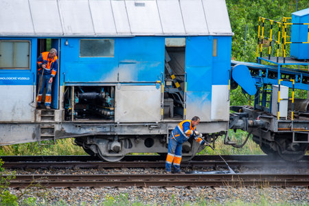 Brno, Czech republic - 19.6.2020: Railway workers are working on reconstruction of train path from Brno city to Zastavka u Brna village.のeditorial素材