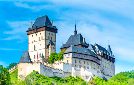 View of the famous Karlstejn castle, Czech republic. Castle built in gothic style by king and emperor of Roman rise, Charles IV. Czech historic heritage, beautiful summer day.のeditorial素材
