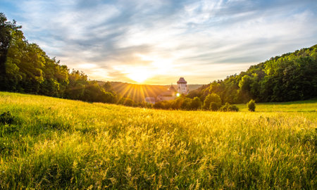 Beautiful sunset over famous Czech Republic castle, the Karlstejn. Medieval castle built in gothic style by king and emperor of old Roman rise, Charles IV. Dramatic sky, vibrant colors.のeditorial素材