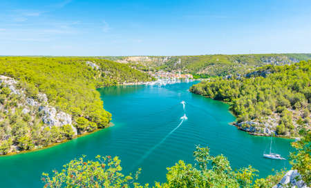 Higway over the Krka river, Croatia. View from famous bridge near the Sibenik and Skradin city. River with boat and yacht.の写真素材