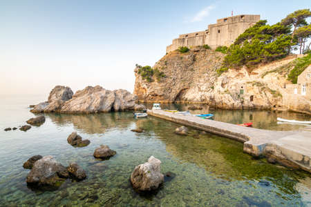 Dubrovnik old town small west harbor with boats. Near is the Lovrijenac fortress. Summer weather, morning soft light. Part of  .の写真素材