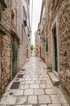 Narrow old town street at Sibenik city, Croatia. Famous tourist destination.の写真素材