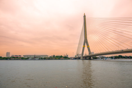 View of Bangkok bridge over the river during sunset time.の写真素材