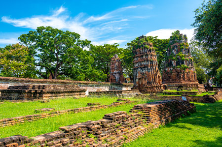 Ruins of ancient city and temples Ayutthaya, Thailand. Old kingdom of Siam. Summer day with blue sky. Famous tourist destination, spiritual place near Bangkok.のeditorial素材