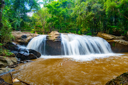 Mae sa waterfall near Chiang Mai city, Thailand. Flowing water in tropical rainforest.の写真素材
