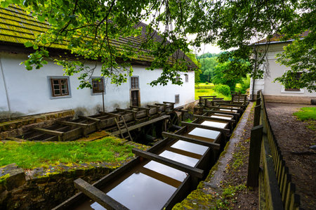 The mill in Babiccino Valley is a historic structure set amidst lush nature, representing the rural heritage and charm of Bozena Nemcova's "Babicka," with its tranquil surroundings and scenic beauty.の写真素材