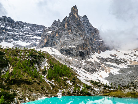 Aerial drone view of beautiful Lake Sorapis, Lago di Sorapis, in Dolomites, popular travel destination in Italy. Blue green lake in Italian Dolomitesの写真素材