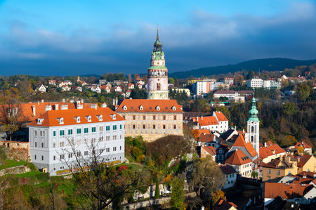 Panoramic view of Cesky Krumlov, showcasing the UNESCO-listed historic center surrounded by the Vltava River in a meander. A sunny autumn day highlights the town's charm.の写真素材