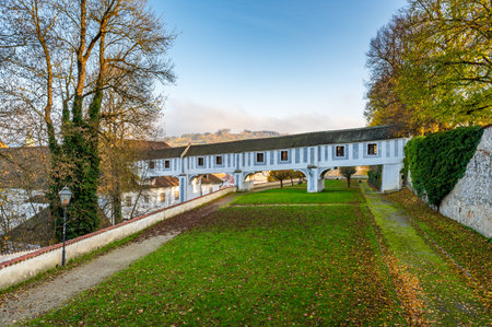 Covered bridge from Cesky Krumlov Castle leading into the park, arching over a narrow alley. The historic structure adds a touch of charm to the peaceful surroundingsの写真素材