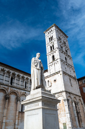 Panoramic view of Chiesa di San Michele in Foro in the historic center of Lucca Italy on a sunny summer day with clear blue sky and warm light on the ancient architectureの写真素材