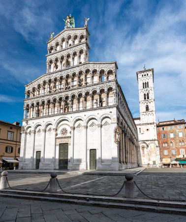 Panoramic view of Chiesa di San Michele in Foro in the historic center of Lucca Italy on a sunny summer day with clear blue sky and warm light on the ancient architectureの写真素材