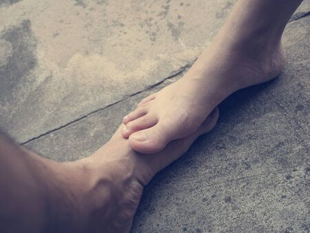 close up, couple bare foot on bare floor.の写真素材