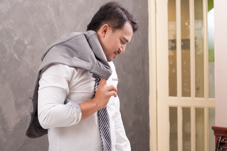 Portrait of stressed and tired of businessman with isolated white background.の写真素材