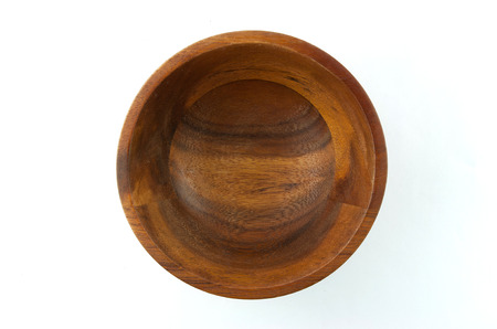 Top view of wooden bowl isolated on white backgroundの写真素材