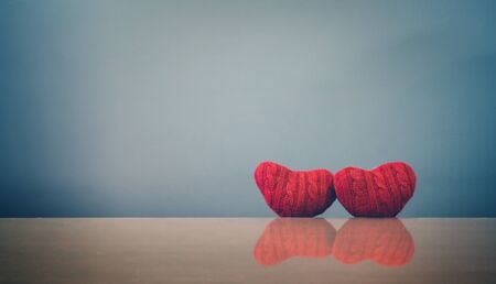 Valentine's day concept. Two red hearts  on blue background. Vintage and retro color.の写真素材
