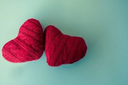 Valentine's concept. Red hearts on blue background with copy space.