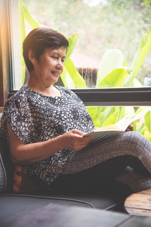 Happiness Asian senior woman reading a book.の写真素材