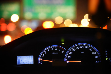Close up car instrument panel with night light of the road.の写真素材