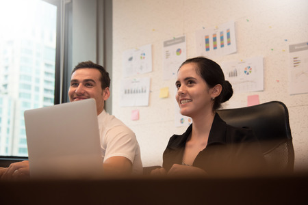 Business people smiling with working at the office.の写真素材