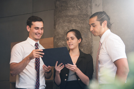 Business people doing brainstorming meeting at the office.の写真素材