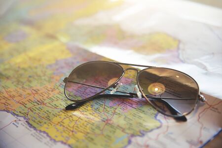 Close up sunglasses on the map.の写真素材