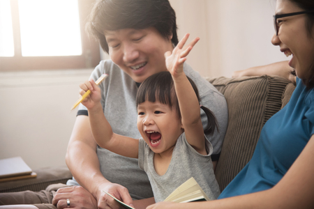 Cheerful of Asian family with young father, mother and little kid girl.の写真素材