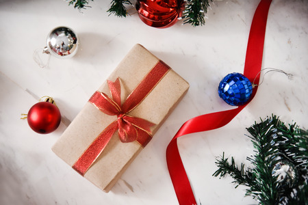 Top view of present box on marble background for Christmas and New year.
