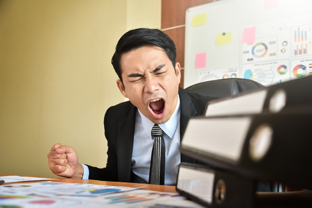 Depressed Angry Young Asian Businessman is yelling. Angry. Stress.の写真素材